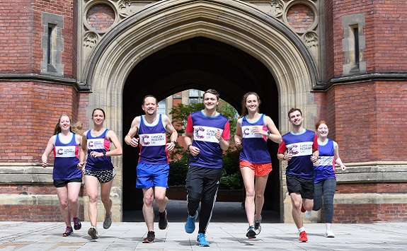 The CRUK Team running in front of the Newcastle University Arches